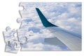 Airplane wing above the clouds in jigsaw puzzle shape - concept image which can mean: overcome fear of flying or solutions to air