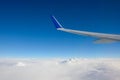 Airplane wing with blue sky has a lot of windows Royalty Free Stock Photo