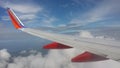 Airplane wing with Clouds under blue sky Royalty Free Stock Photo