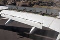 Airplane wing with flaps and spoilers extended to slow down