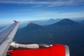 Airplane Wing Flying Above Mountains Royalty Free Stock Photo