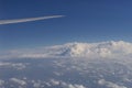 Airplane wing flying in a beautiful blue sky with clouds Royalty Free Stock Photo