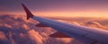 The airplane wing gliding through vibrant sunset clouds above the horizon. AI generated image Royalty Free Stock Photo