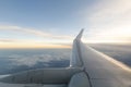 Airplane wing over the clouds during the flight Royalty Free Stock Photo