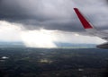 Airplane wing from passenger window Royalty Free Stock Photo