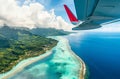 Airplane Wing Soaring Above Scenic Tropical Island Royalty Free Stock Photo