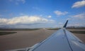 Airplane wing during take off or landing Royalty Free Stock Photo