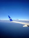 Airplane wing of a Travel Service charter airline flying over the Canary Islands Spain.