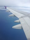 Airplane wing under blue sky Royalty Free Stock Photo