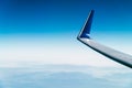 Airplane Wing View Above Clouds