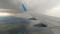 Airplane wing view out of the window on the cloudy sky The Earth Royalty Free Stock Photo