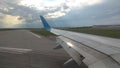 Airplane wing view out of the window on the cloudy sky The Earth Royalty Free Stock Photo