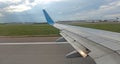 Airplane wing view out of the window on the cloudy sky The Earth Royalty Free Stock Photo