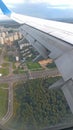 Airplane wing view out of the window on the cloudy sky The Earth Royalty Free Stock Photo