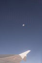 Airplane Wing Through The Airplane Window With The Moon In The Background