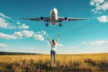 Airplane and woman on the field at sunset in autumn Royalty Free Stock Photo