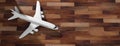 Airplane on wooden floor background, top view, copy space. 3d illustration Royalty Free Stock Photo