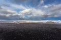 Airplane wreckage on black sand beach Royalty Free Stock Photo