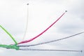 Airplanes on aerobatic show, bright multicolor smoke trails. Aircrafts, flying display and aerobatics