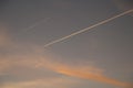 Airplanes and contrails of another airplanes at sunset.