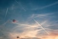 Airplanes Flying Through Cloudy Sky leaving contrails behind