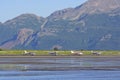 Airplanes Lined up on a Remote Shore