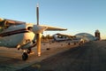 Airplanes lined up on the tarmac.