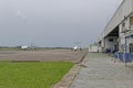 Airplanes parked up on the Concrete Airport Apron of Port Gentil on an overcast day in December,