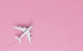 Airplanes on a pink background with Different holiday or business trip destinations