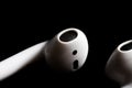 Airpod closeup on a black background Royalty Free Stock Photo