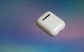 Airpods on colorful background. Apple headphones. Royalty Free Stock Photo