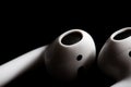 Airpods on a black background Royalty Free Stock Photo