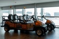 Airport battery powered vehicles for transporting passengers around the airport building. Modern airport service