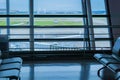 Airport bench and window in the departure lounge