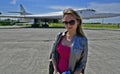 Beautiful woman at a military airfield. Royalty Free Stock Photo