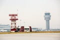 Airport control tower and radar communication tower Royalty Free Stock Photo