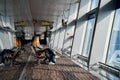 Airport corridor. Female passengers are waiting for their flight at the airport on the bench. Airport interior Royalty Free Stock Photo