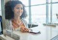 Airport counter, black woman and phone at ticket desk with happiness from travel and vacation. Air traveling customs Royalty Free Stock Photo