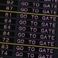 Airport departure board with go to gate sign. Royalty Free Stock Photo