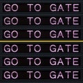 Airport departure board with go to gate sign. Royalty Free Stock Photo