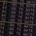 Airport departure board with go to gate sign. Royalty Free Stock Photo