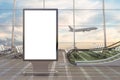 Airport departure lounge. Blank billboard stand and airplane on background. Royalty Free Stock Photo