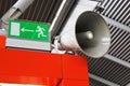 Airport emergency exit sign and public address system.