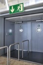 Airport emergency exit way out way metallic doors. Alert