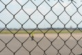 Airport employees are on the runway. The territory of the private airfield is fenced with barbed wire and a fence. The traffic