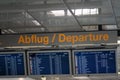 Airport flight information on a large screen international departure board