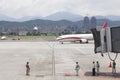 Airport ground service await aircraft approaching with jet brid