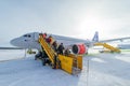 Kiruna, Lapland, Sweden - March 16, 2020: Passengers deplaning airliner from SAS. Royalty Free Stock Photo