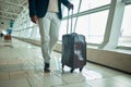 Airport legs, travel and man walking to airplane, flight booking or transportation for corporate trip. Luggage suitcase Royalty Free Stock Photo