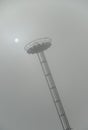 Airport light tower in the fog Royalty Free Stock Photo